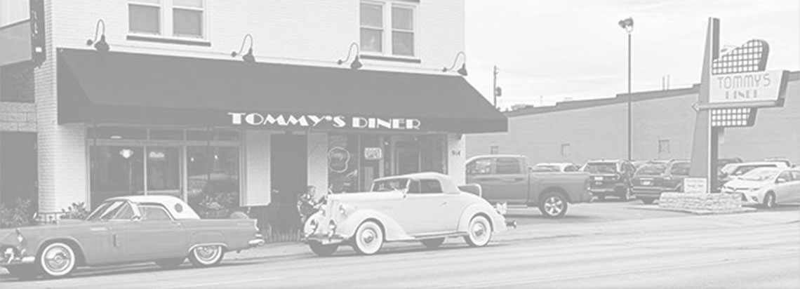 Tommy's Diner exterior with vintage cars